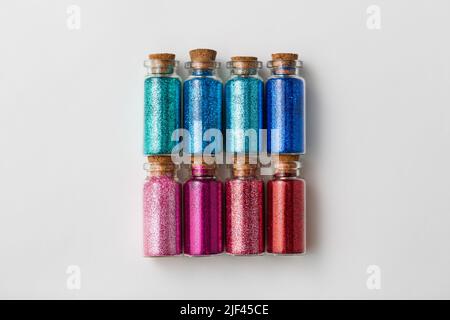 set of glitters in bottles over white background Stock Photo