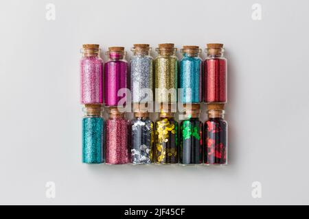 set of glitters in bottles over white background Stock Photo