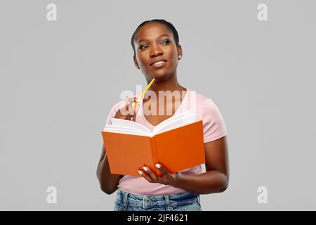 happy african american woman with notebook Stock Photo