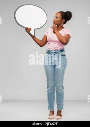 african american woman holding speech bubble Stock Photo