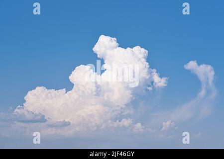 White clouds on the blue sky at sunny day Stock Photo