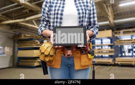 female worker with tools and tablet pc at factory Stock Photo