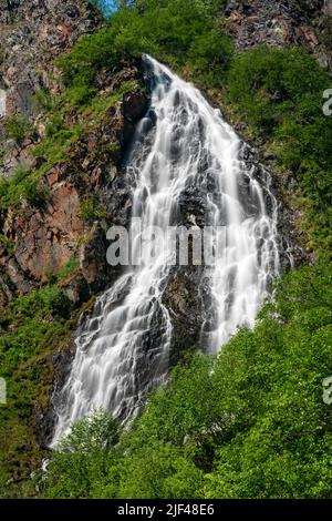 Horsetail Falls cascade down the cliffs of Keystone Canyon outside Valdez in Alaska Stock Photo