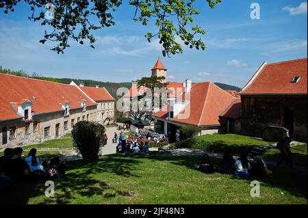 Brno, Czech Republic - April 30, 2022: People sitting on yard Veveri castle. Stock Photo