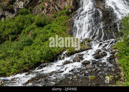 Horsetail Falls cascade down the cliffs of Keystone Canyon outside Valdez in Alaska Stock Photo