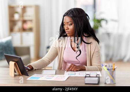 african woman working on ui design at home office Stock Photo