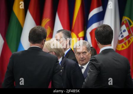 Finland's President Sauli Niinisto (2nd R) talks to colleagues at a NATO heads of state and governments and partners meeting at the NATO summit in Madrid, Spain, Wednesday, June 29, 2022.    Photo by Paul Hanna/UPI Stock Photo