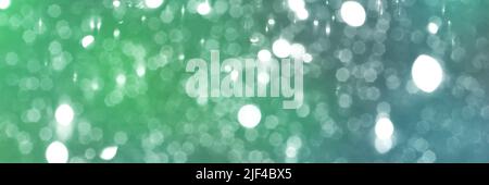 Summer green and blue sparkling glitter bokeh background, banner texture. Abstract defocused lights header. Wide screen wallpaper. Panoramic web banne Stock Photo