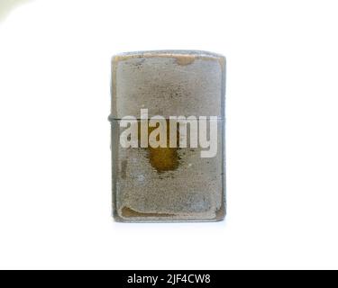 Old vintage zippo lighters isolated on white background. Stock Photo