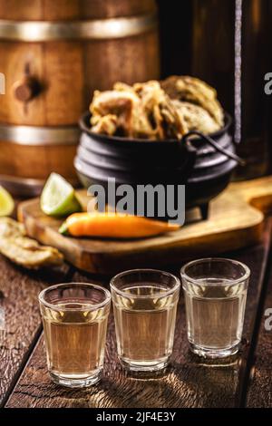 glass of Cachaça, pinga, cana or caninha is the sugar cane brandy