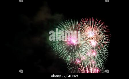 Spectacular colorful fireworks splashing in the night sky Stock Photo