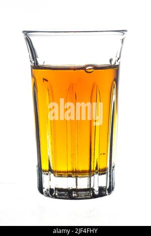 Cocktail Glass with brandy or whiskey - Small Shot. Isolated on white background Stock Photo