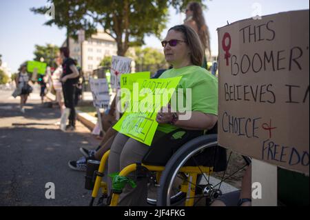 Washington, United States. 29th June, 2022. An abortion-rights advocate holds a sign that says 'Bodily Autonomy for All' sits outside the U.S. Supreme Court in Washington, DC on Wednesday, June 29, 2022. Photo by Bonnie Cash/UPI Credit: UPI/Alamy Live News Stock Photo