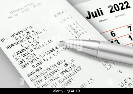 Hamburg, Germany -  June 24   2022:  German purchase voucher staple foods with calendar 2022 July Stock Photo