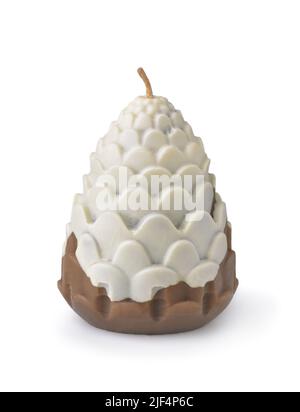 Front view of handmade pine cone candle isolated on white Stock Photo