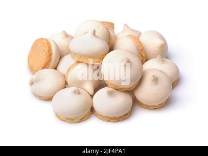 Pile of small meringue biscuits isolated on white Stock Photo