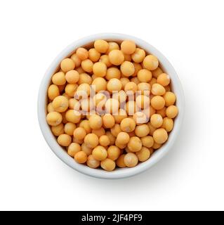 Top view of dried yellow peas in ceramic bowl isolated on white Stock Photo