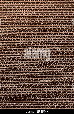 Close up of stacked brown corrugated cardboard texture. Side view Stock Photo