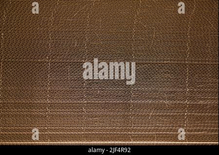 Corrugated cardboard for packing. abstract background horizontal lines with wavy lines of beige color Stock Photo