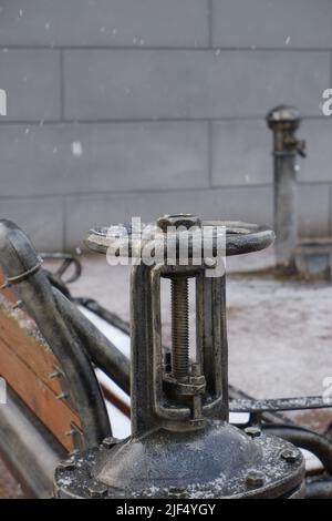 Steampunk-style water pump with valves and pressure gauges Stock Photo