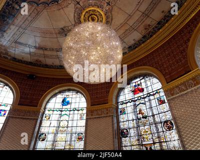 London, Greater London, England, June 15 2022: The Victoria and Albert Museum historic cafe with a lavish interior including stained glass windows. Stock Photo