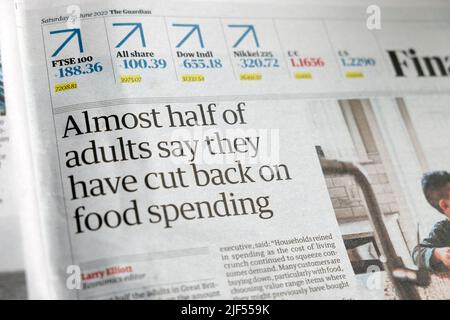 'Almost half of adults say they have cut back on food spending' Guardian Financial newspaper headline cost of living crisis clipping 25 June 2022 UK Stock Photo