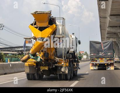 The concrete mixer truck goes on the highway Stock Photo