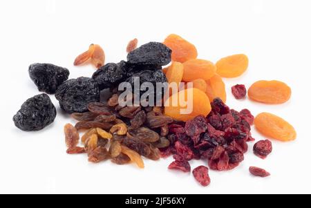 Dried fruits isolated on bright background. Close up view. Stock Photo