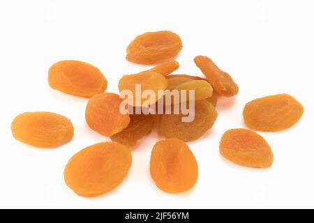 Dried apricots isolated on bright background. Healthy food concept. Close up view. Stock Photo