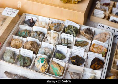 Variety of mineral speciments on counter in souvenir shop Stock Photo