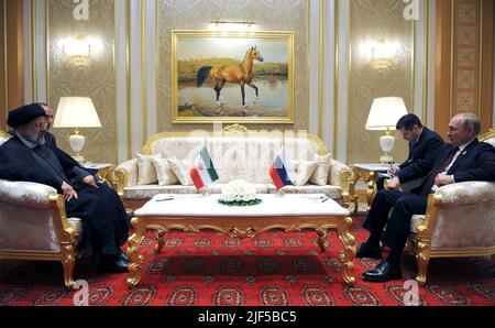 Russian President Vladimir Putin in meeting with President of Iran Sayyid Ebrahim Raisi. Vladimir Putin met with President of the Islamic Republic of Iran Sayyid Ebrahim Raisi on the sidelines of the Caspian summit. Stock Photo