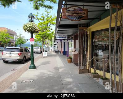 Coeur d'Alene, Idaho - June 17, 2022 - Street scene in city's downtown commercial area. Stock Photo