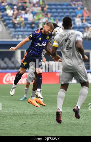 Seattle, WA, USA. 29th June, 2022. Seattle Sounders midfielder Albert Rusnak heads the ball during the first half of the MLS soccer match between CF Montreal and Seattle Sounders FC at Lumen Field in Seattle, WA. Steve Faber/CSM/Alamy Live News Stock Photo