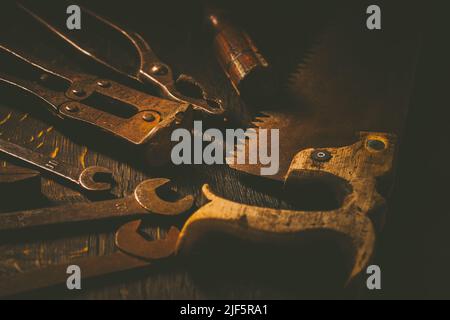 Collection of vintage carpentry tools on old workbench: woodworking, craftsmanship and handwork concept Stock Photo