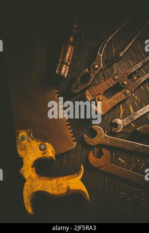 Collection of vintage carpentry tools on old workbench: woodworking, craftsmanship and handwork concept Stock Photo