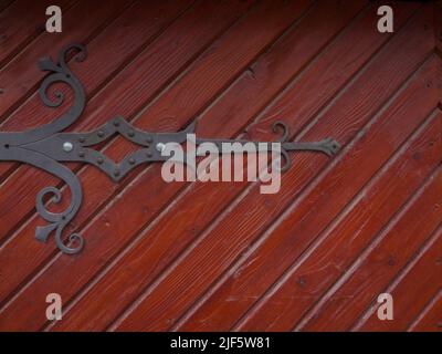 Ancient wooden door with iron curtain Stock Photo