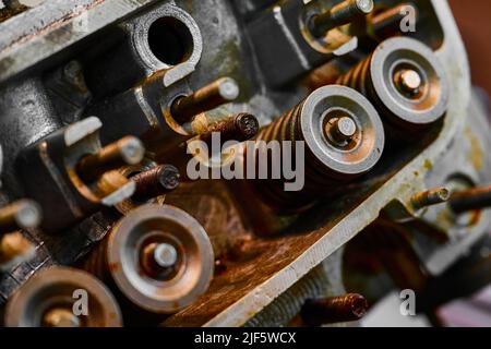 Petrol engine of car with rollers in repairing workshop Stock Photo