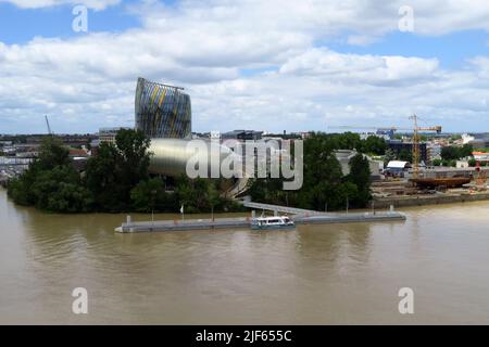The Cite du Vin is a modern high tech museum dedicated to Bordeaux's wine industry. The Museum stands on the south bank of the Garonne river. Stock Photo