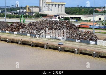 Scrap metal piled up on the quayside on the Garonne River downstream from the French city of Bordeaux Stock Photo