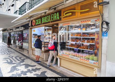 LISBON, PORTUGAL - JUNE 4, 2018: People visit Casa Brasileira bakery in Lisbon. Lisbon is the 11th-most populous urban area in the EU (2.8 million peo Stock Photo