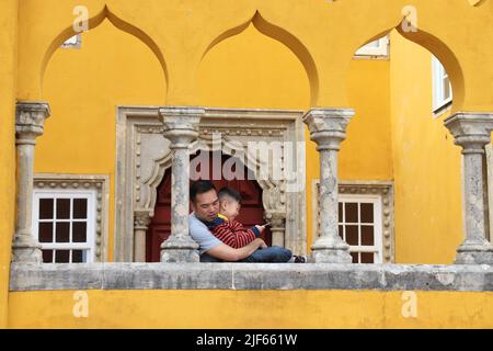 SINTRA, PORTUGAL - MAY 21, 2018: Tourists visit Pena Palace tourist attraction in Sintra. Portugal had 12.7 million foreign visitors in 2017. Stock Photo