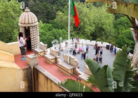 SINTRA, PORTUGAL - MAY 21, 2018: Tourists visit Pena Palace tourist attraction in Sintra. Portugal had 12.7 million foreign visitors in 2017. Stock Photo