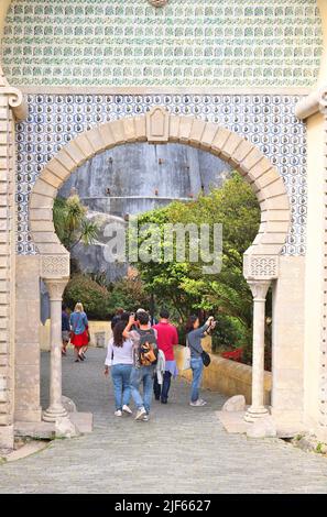 SINTRA, PORTUGAL - MAY 21, 2018: Tourists visit Pena Palace tourist attraction in Sintra. Portugal had 12.7 million foreign visitors in 2017. Stock Photo