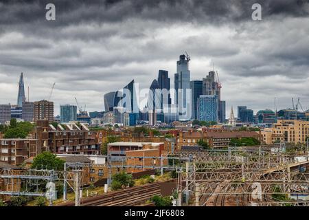 City of London skyline with modern office buildings. Dark clouds over London UK. Stock Photo