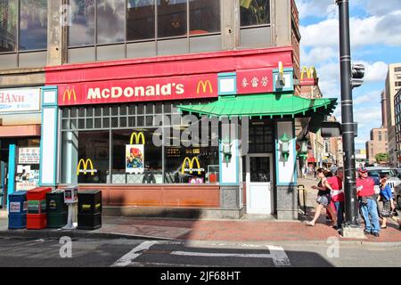 BOSTON, USA - JUNE 8, 2013: People visit McDonald's restaurant in Chinatown in Boston. Boston's Chinatown is the only surviving Chinatown district in Stock Photo