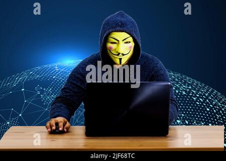 scammer calls the victim holding bank credit cards in his hand, internet scammer Stock Photo