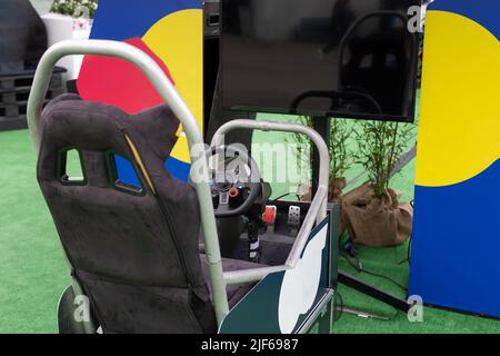 Professional Gaming Seat with Steering Wheel, Pedals and Screen for driving Simulator Video Game. Stock Photo