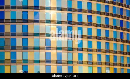 Glass facade modern building. Bright golden colors. Background image Stock Photo