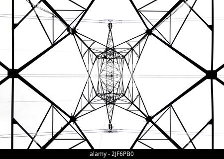 From below black and white close up of energy tower creating abstract background geometric shapes Stock Photo