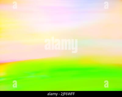Wonderful blurry landscape with green hills and sunset on blue sky. Green blurred background and sunlight with blue sky. Stock Photo